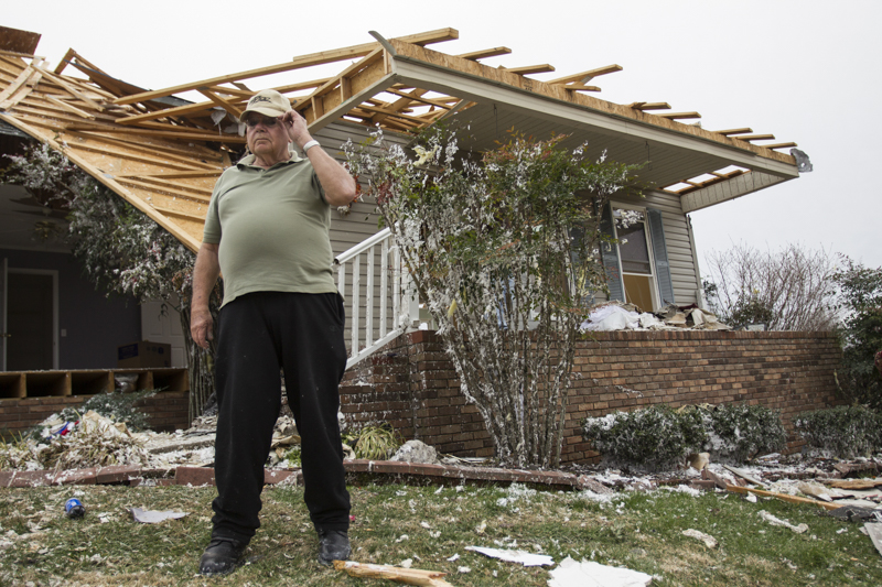 Staff photo by Troy Stolt / Glen Bilbrey stands in front of his home, which was ripped apart Tuesday morning by a tornado, in Cookeville, Tenn on Wednesday, March 4, 2020. Bilbrey said he had tried to get to the basement, but he and his wife were trapped before they could get there, a search and rescue crew was able to save him by ripping a wall off his house.
