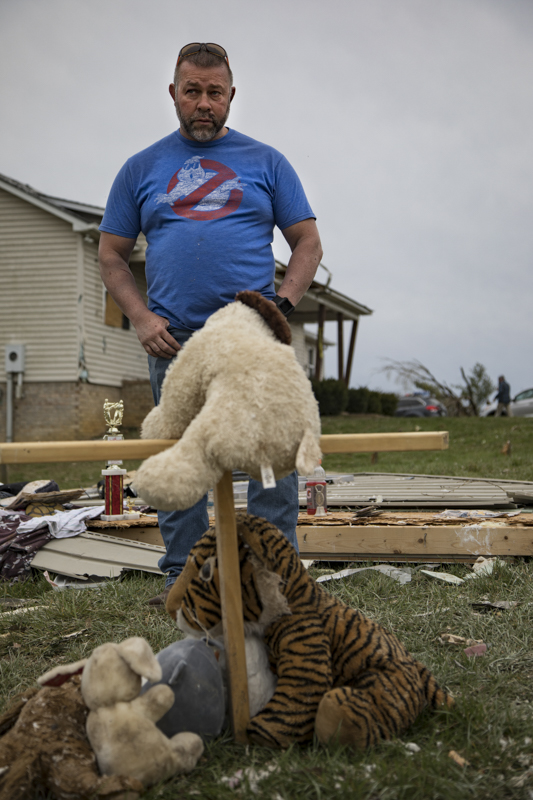 Staff photo by Troy Stolt / Mike Phillips stands in front of a memorial he made to honor his foster daughter Bridget McCormick, 13, after she was killed when a tornado destroyed the Phillips family's home early Tuesday morning in Cookeville, Tenn. on Wednesday, March 4, 2020. Phillips and his wife Kim were pinned down by a couch as the tornado caused the glass windows of the home to explode, and was unable to help his six children get to safety, his son found Bridget outside where the memorial was built.