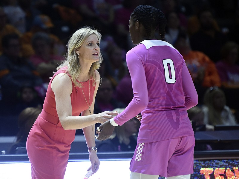 AP photo by Saul Young / Tennessee women's basketball coach Kellie Harper talks with Rennia Davis during a home game against Vanderbilt on Feb. 23.
