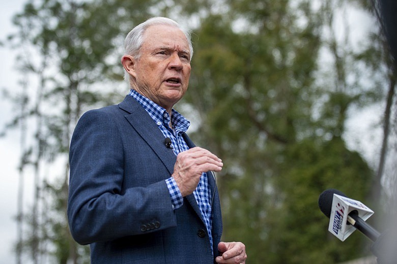 Jeff Sessions talks with the media after voting in Alabama's primary election, Tuesday, March 3, 2020, in Mobile, Ala. (AP Photo/Vasha Hunt)