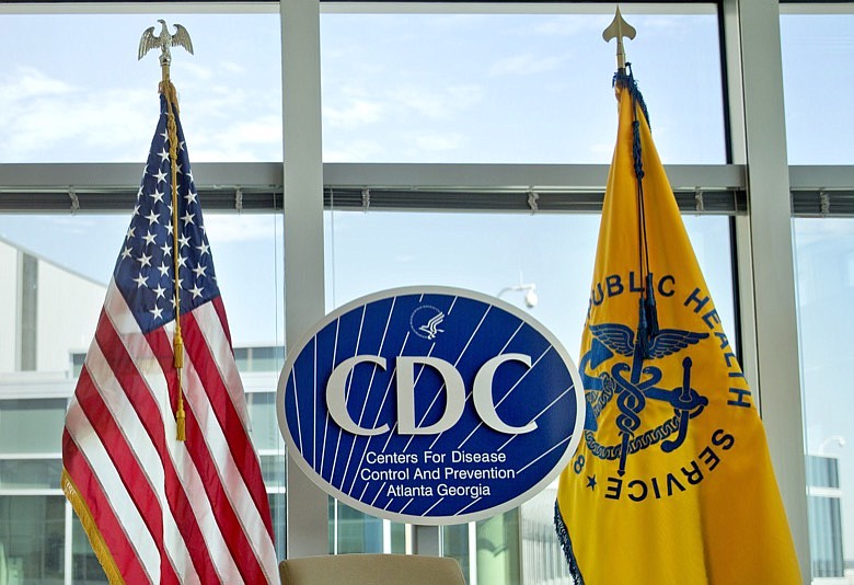 This Nov. 19, 2013 file photo shows a Centers for Disease Control and Prevention logo at the agency's federal headquarters in Atlanta. A CDC report released on Wednesday, March 4, 2020, found that black children appear to be more likely than white kids to be diagnosed with attention deficit hyperactivity disorder and other learning disabilities. Previous studies had found the diagnosis was far more likely in white kids. (AP Photo/David Goldman, File)