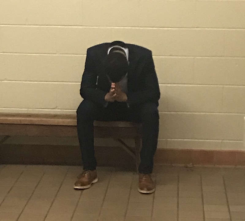 E'Jay Ward stopped to pray after his team made the game-winning shot in a dramatic game against Red Bank Tuesday night. Staff photo by Stephen Hargis. 