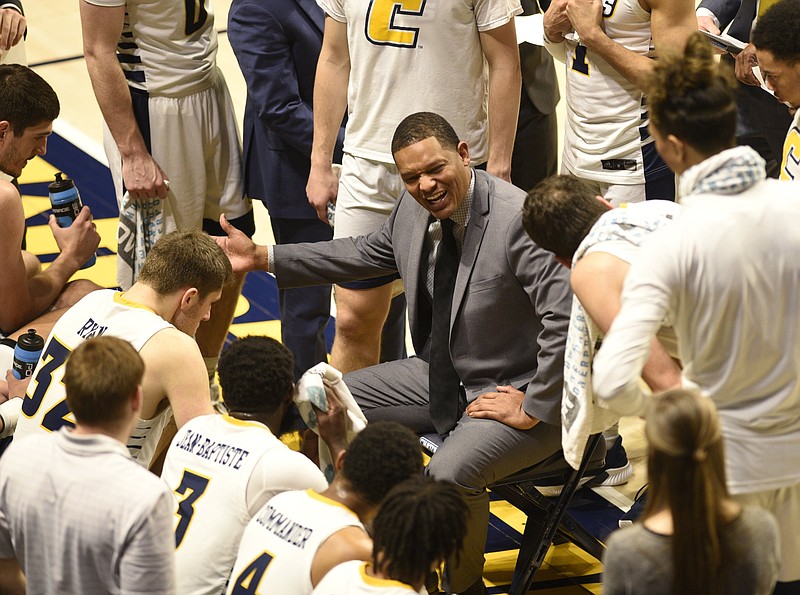 Staff photo by Robin Rudd / UTC men's basketball coach Lamont Paris instruct the Mocs during a timeout in a home game against Mercer on Feb. 22. The Mocs lost that day but then won back-to-back games to finish the regular season and were seeded sixth for the SoCon tournament.