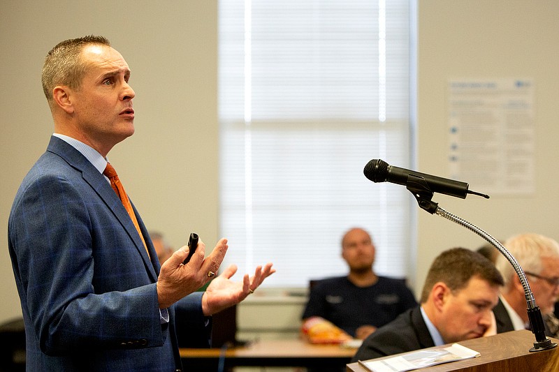 Staff Photo By C.B. Schmelter / Mike Raisor, senior vice president of MGT Consulting Group, presents to members of the school board last Tuesday a facilities master plan for the Hamilton County Schools.