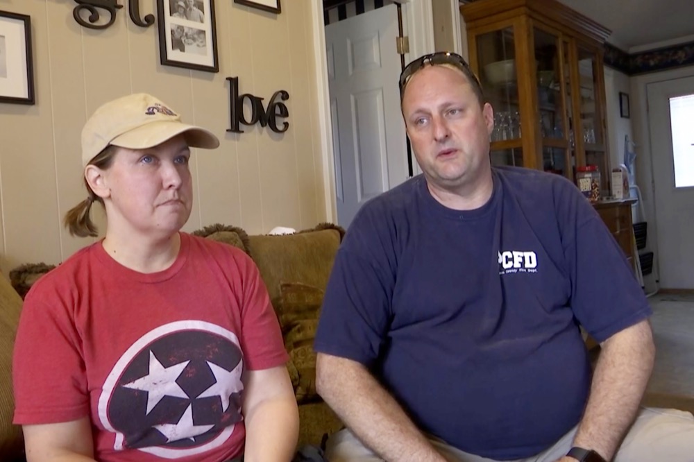 In this Wednesday, March 4, 2020 photo, Amy and Darrell Jennings describe what happened moments after a tornado tore through their Tennessee community from their Putnam County, Tenn., home. Except for a few broken windows, the Jennings' house was still standing. It quickly became a shelter for those who were suddenly left with nothing. (AP Photo/Kristin Hall)