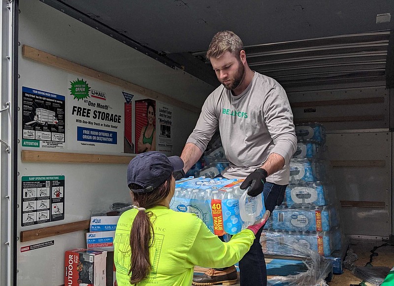 Jonathon Betze of Bellhops delivers water to help with relief efforts after tornadoes hit the Nashville area Tuesday. 