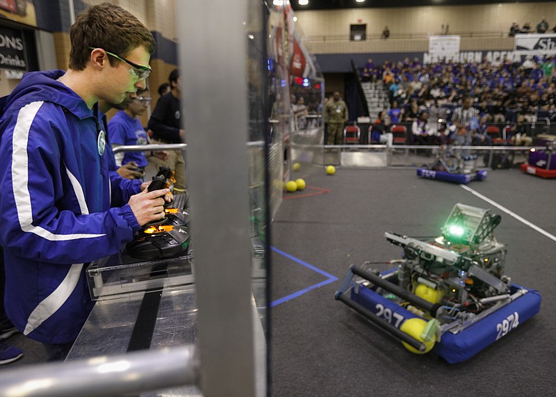 Staff photo by Troy Stolt / Noah Bruckner, a senior from Walton high school in Marietta, Georgia, controls robot 2974 during the For Inspiration and Recognition of Science and Technology (FIRST) Tech Robotics competitions on Friday, March 6, 2020 at the convention center in Dalton, Georgia.