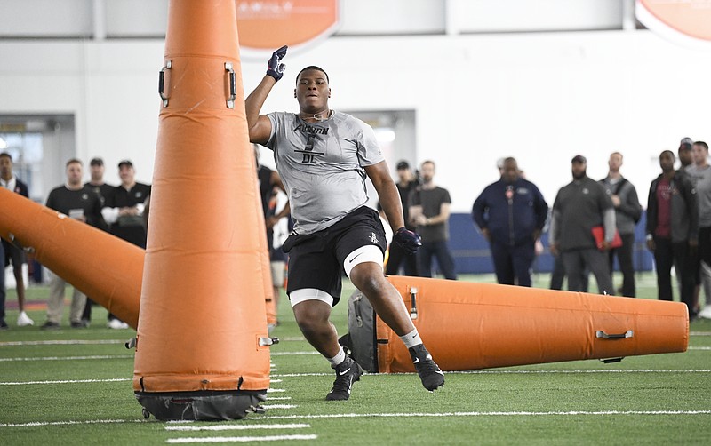 AP photo by Julie Bennett / Defensive tackle Derrick Brown works out during Auburn's pro day on Friday.