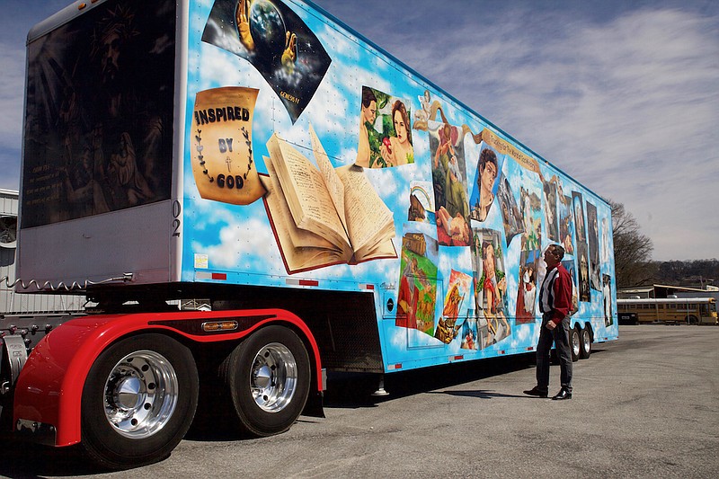 Staff photo by Wyatt Massey / On March 1, 2020, James Hodge stands beside his tractor-trailer painted with scenes from the Bible. He is hoping to combine his decades of experience as a driver with his faith to launch a full-time trucking ministry.