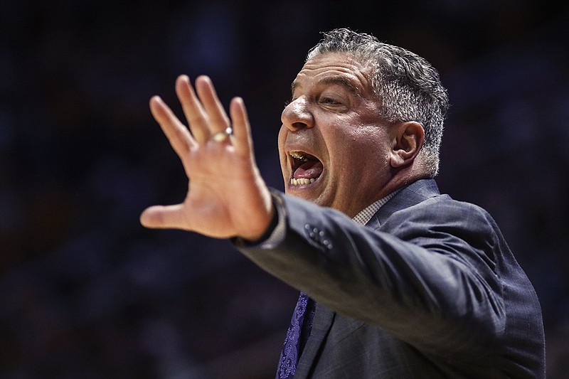 AP photo by Wade Payne / Auburn men's basketball coach Bruce Pearl shouts instructions during Saturday's game at Tennessee, where he previously coached.
