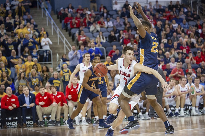 AP photo by Daniel R. Patmore / Belmont's Grayson Murphy tries to drive past Murray State's KJ Williams during the second half of the Ohio Valley Conference tournament title game Saturday night in Evansville, Ind.