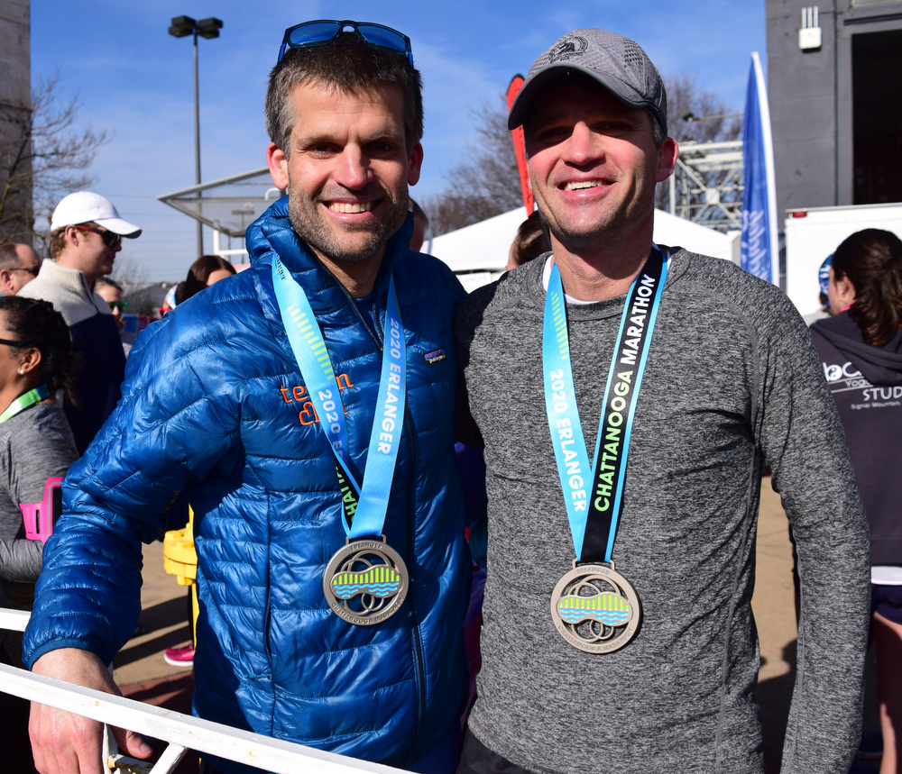 Staff Photo by Robin Rudd / From left, brothers Bob and Bradley Adams pose with their medals. Bob was first and Bradley second in the marathon. The 5th Erlanger Chattanooga Marathon was run on March 8, 2020.