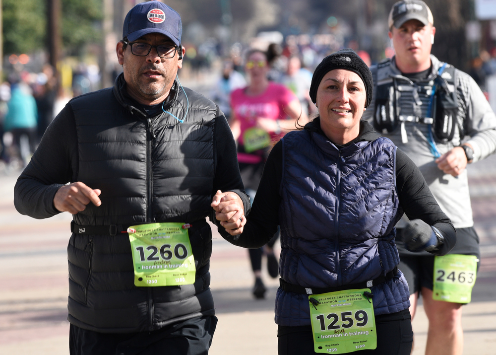 Staff Photo by Robin Rudd / Hand-in-hand Andres and Ana Garcia finish the half marathon. The 5th Erlanger Chattanooga Marathon was run on March 8, 2020.