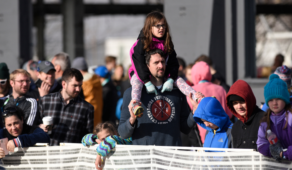 Staff Photo by Robin Rudd / Spectators await the runners near the finish line in front of the First Tennessee Pavilion on Reggie White Blvd.. The 5th Erlanger Chattanooga Marathon was run on March 8, 2020.