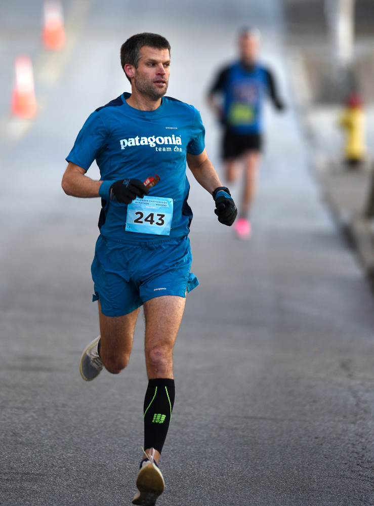 Staff Photo by Robin Rudd / Bob Adams, who would win the marathon with a time of 2:38:43, nears the ninth miles as he turns onto Martin Luther King Jr. Blvd. from Lindsey St.. The 5th Erlanger Chattanooga Marathon was run on March 8, 2020.