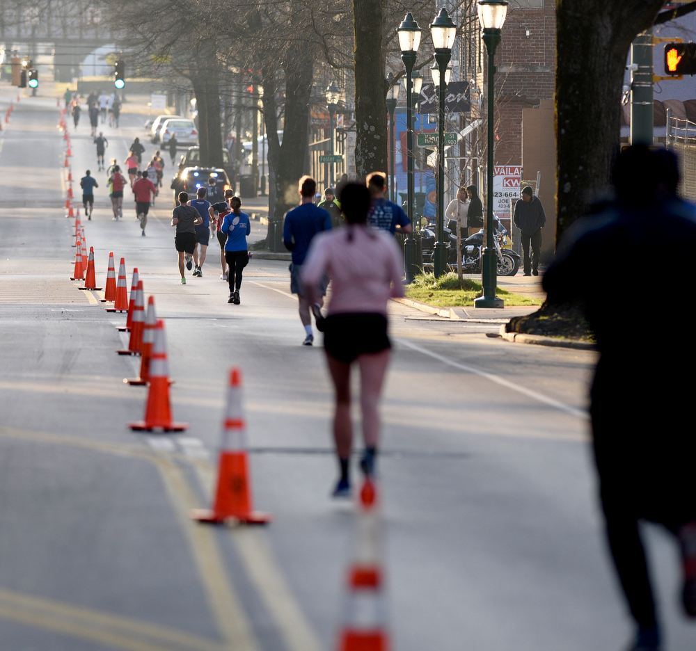 Staff Photo by Robin Rudd / Runners head east on Martin Luther King Jr. Blvd. The 5th Erlanger Chattanooga Marathon was run on March 8, 2020.