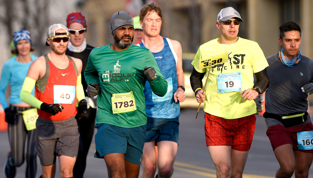 Staff Photo by Robin Rudd / Participants head east, into the rising sun, on Martin Luther King Jr. Blvd. The 5th Erlanger Chattanooga Marathon was run on March 8, 2020.