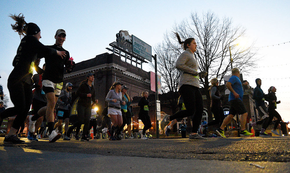 Staff Photo by Robin Rudd / Having finished the first mile runners pass the Choo Choo on Market Street. The 5th Erlanger Chattanooga Marathon was run on March 8, 2020.