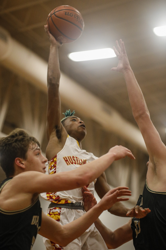 Staff photo by Troy Stolt / Howard's Dicourius Edward (3) makes a hook shot during the boys' Class AA basketball sectional championship game between Upperman and Howard on Monday, March 9, 2020 in Chattanooga, Tenn. Upperman would win the game and advance to the state tournament.