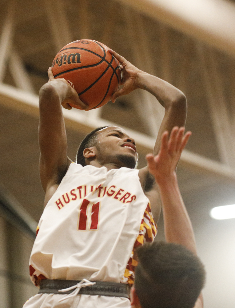 Staff photo by Troy Stolt / Howard's Xavier Fisher (11) makes a shot during the boys' Class AA basketball sectional championship game between Upperman and Howard on Monday, March 9, 2020 in Chattanooga, Tenn. Upperman would win the game and advance to the state tournament.
