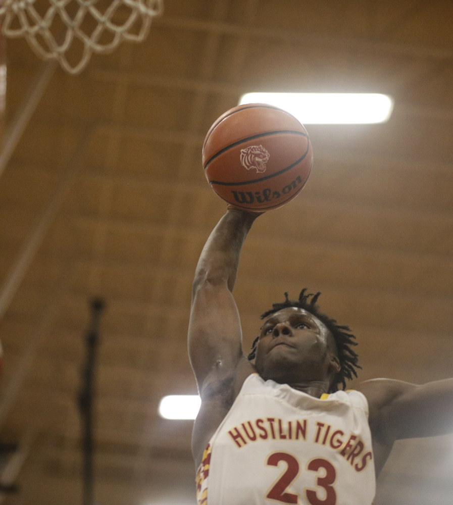 Staff photo by Troy Stolt / Howard's Calvin James (23) dunks the ball during the boys' Class AA basketball sectional championship game between Upperman and Howard on Monday, March 9, 2020 in Chattanooga, Tenn. Upperman would win the game and advance to the state tournament.
