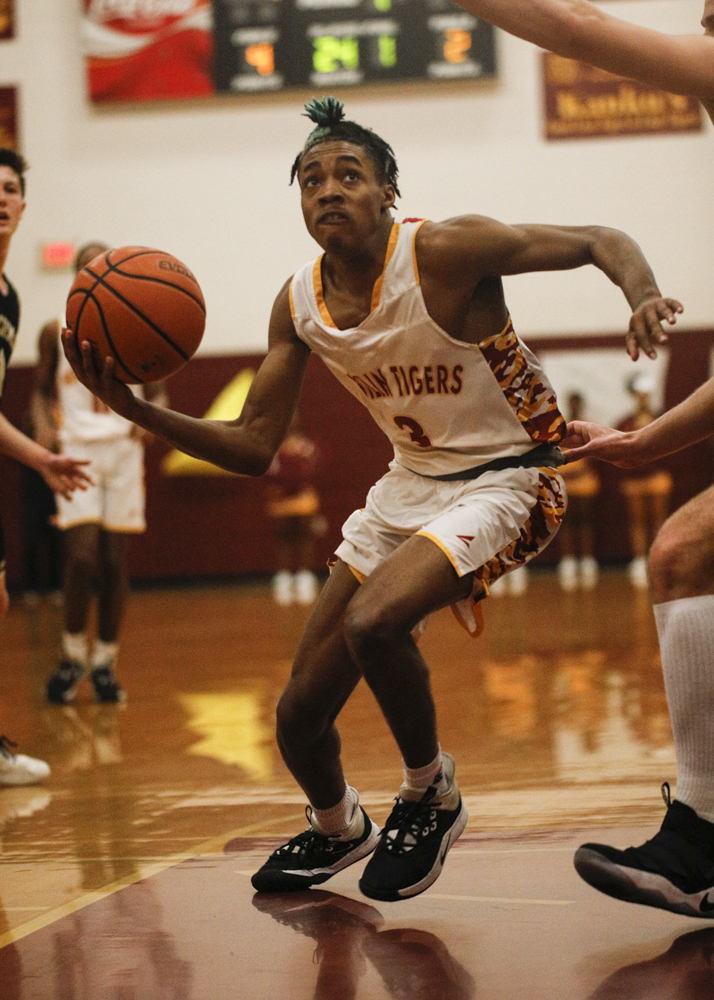 Staff photo by Troy Stolt / Howard's Dicourius Edward (3) drives to the basket during the boys' Class AA basketball sectional championship game between Upperman and Howard on Monday, March 9, 2020 in Chattanooga, Tenn. Upperman would win the game and advance to the state tournament.