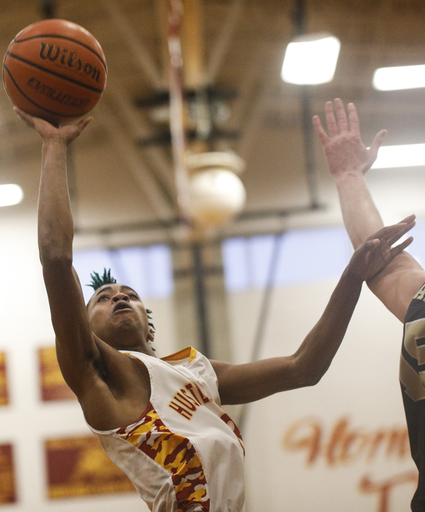 Staff photo by Troy Stolt / Howard's Dicourius Edward (3) takes a shot during the boys' Class AA basketball sectional championship game between Upperman and Howard on Monday, March 9, 2020 in Chattanooga, Tenn. Upperman would win the game and advance to the state tournament.