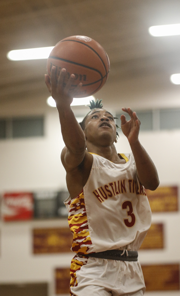 Staff photo by Troy Stolt / Howard's Dicourius Edward (3) makes a layup during the boys' Class AA basketball sectional championship game between Upperman and Howard on Monday, March 9, 2020 in Chattanooga, Tenn. Upperman would win the game and advance to the state tournament.