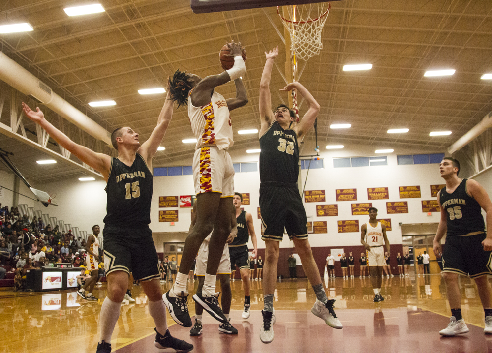 Staff photo by Troy Stolt / Howard's Kerrick Thorne (5) grabs a rebound during the boys' Class AA basketball sectional championship game between Upperman and Howard on Monday, March 9, 2020 in Chattanooga, Tenn. Upperman would win the game and advance to the state tournament.