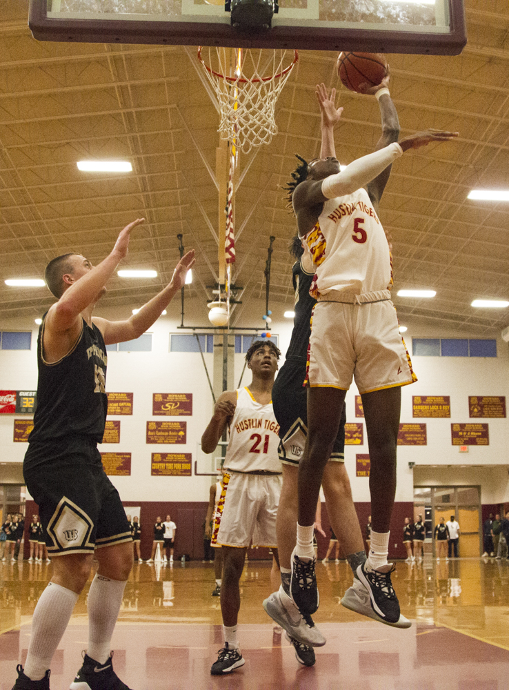 Staff photo by Troy Stolt / Howard's Kerrick Thorne (5) makes a basket in the paint during the boys' Class AA basketball sectional championship game between Upperman and Howard on Monday, March 9, 2020 in Chattanooga, Tenn. Upperman would win the game and advance to the state tournament.