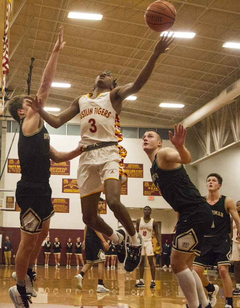 Staff photo by Troy Stolt / Howard's Dicourius Edward (3) is fouled during the boys' Class AA basketball sectional championship game between Upperman and Howard on Monday, March 9, 2020 in Chattanooga, Tenn. Upperman would win the game and advance to the state tournament.