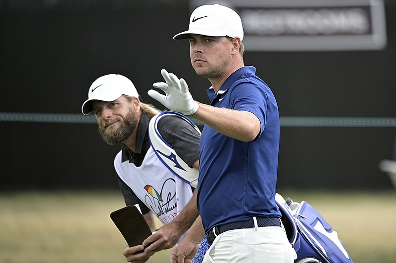 AP photo by Phelan M. Ebenhack / Keith Mitchell waves to a spectator while walking along the 10th fairway during the final round of the PGA Tour's 2020 Arnold Palmer Invitational on March 8 at Bay Hill Club in Orlando, Fla.