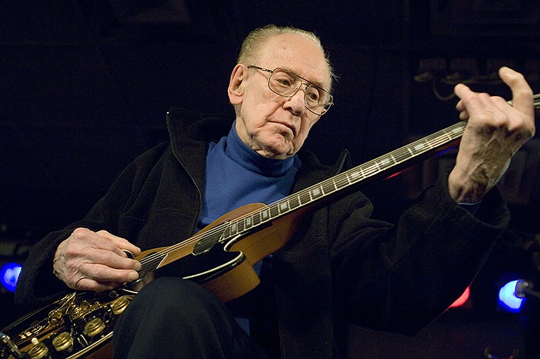 In this Feb. 26, 2007, file photo, guitar legend Les Paul performs at the Iridium Jazz Club in New York. (AP Photo/ Colin Archer, file)