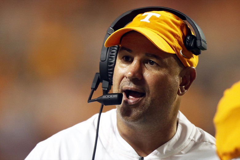 In this 2019 file photo, Tennessee head coach Jeremy Pruitt talks to a player in the second half of an NCAA college football game against Georgia in Knoxville, Tenn. (AP Photo/Wade Payne, File)