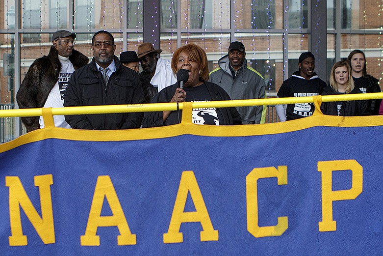 Local NAACP President Elenora Woods, center, leads a "Don't Hate, Vote!" chant at Miller Park after a march against police brutality and excessive force on Wednesday, Jan. 23, 2019, in Chattanooga, Tenn. / Staff photo by C.B. Schmelter