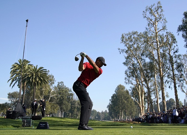 Tiger Woods tees off on the 12th hole during the final round of the Genesis Invitational golf tournament at Riviera Country Club, Sunday, Feb. 16, 2020, in the Pacific Palisades area of Los Angeles. (AP Photo/Ryan Kang)