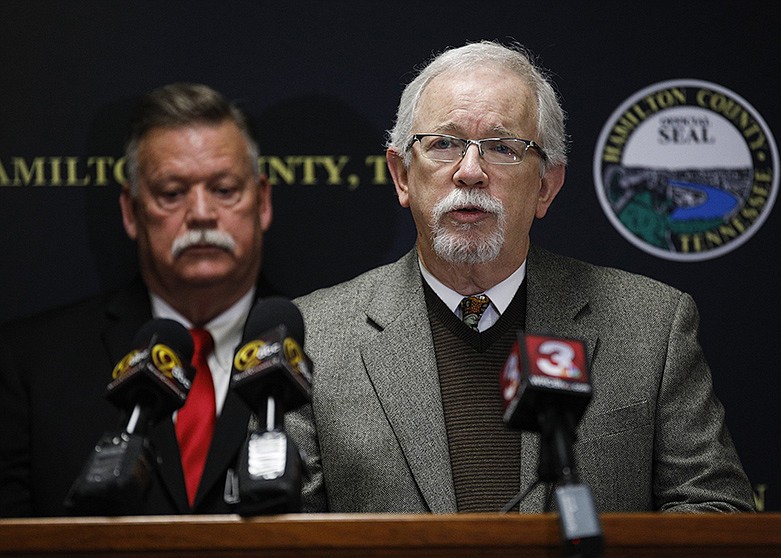 Dr. Paul Hendricks, Health Officer for the Chattanooga-Hamilton County Health Department, speaks during a press conference about the coronavirus (COVID-19) as Hamilton County Mayor Jim Coppinger stands behind him at the McDaniel Building on Thursday, March 12, 2020 in Chattanooga, Tenn. / Staff photo by Troy Stolt