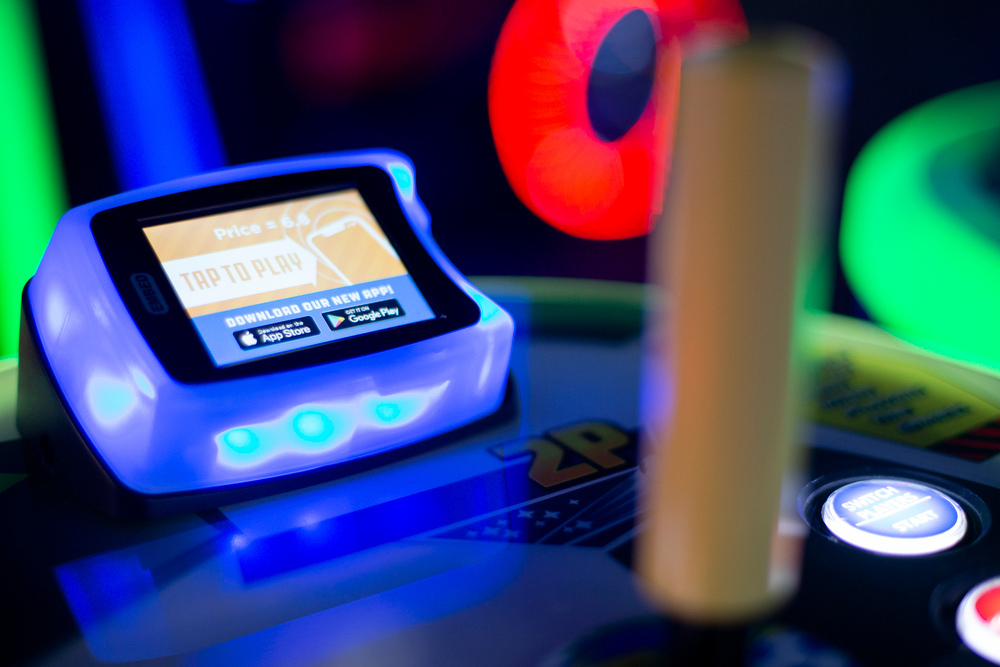 Staff photo by C.B. Schmelter / The payment device is seen on an arcade game at the new Dave & Buster's at Hamilton Place on Thursday, March 12, 2020 in Chattanooga, Tenn. Customers can use a card or an application on their phone to pay to play a game.