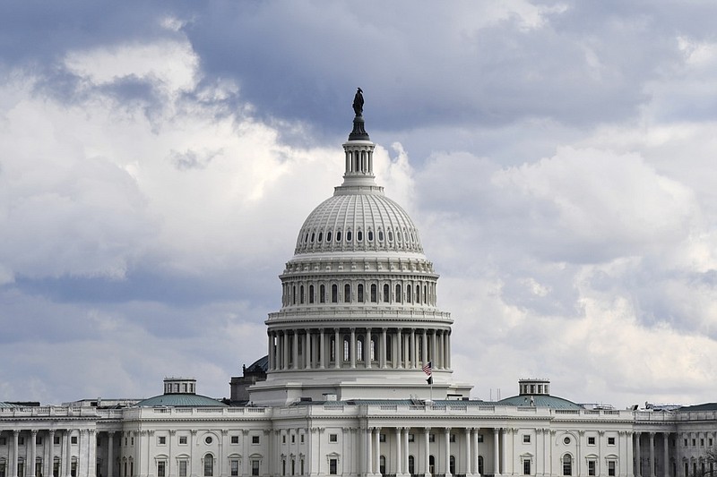 FILE - This Dec. 31, 2019, file photo shows a view of the U.S. Capitol Building in Washington. Congress is shutting the Capitol and all House and Senate office buildings to the public until April in reaction to the spread of the coronavirus. (AP Photo/Susan Walsh, File)