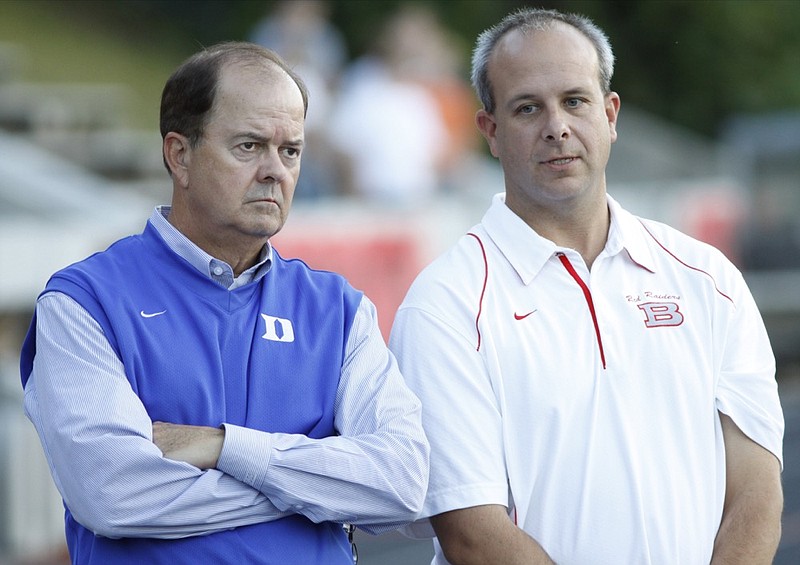 Staff file photo / Baylor School athletic director Thad Lepcio, right, speaks to Duke football coach David Cutcliffe before the Red Raiders' homecoming game against Brentwood Academy on Oct. 8, 2010.