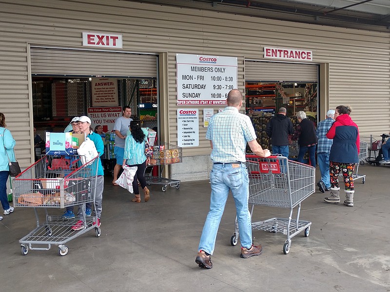 Staff photo by Mike Pare / Shoppers enter and exit the busy Costco store in Ringgold on Friday morning.