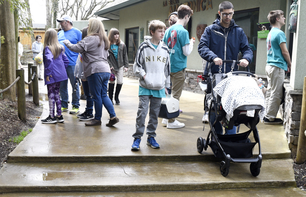 Staff Photo by Robin Rudd / Chattanooga Zoo visitors enjoy a break in the drizzle on Saturday.  The Chattanooga Zoo was one of the few attractions open, following the coronavirus warnings, on March 14, 2020.