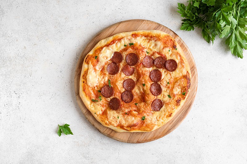 Pi Day Pizza. Homemade Pepperoni and Cheese Pizza for Pi Day Event, top view, copy space. pi day tile pizza tile 3.14 / Getty Images
