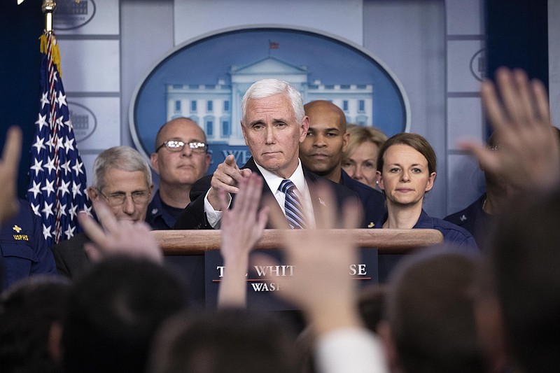 Photo by Alex Brandon of The Associated Press / Vice President Mike Pence points to a question as he speaks during a briefing about the coronavirus in the James Brady Press Briefing Room of the White House on Sunday, March 15, 2020, in Washington.