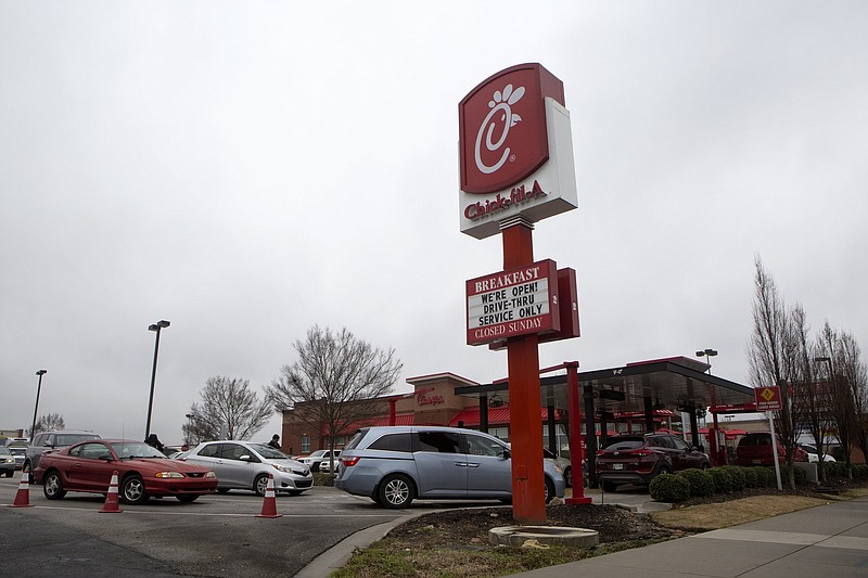 Staff photo by C.B. Schmelter / Cars line up at the Brainerd Road Chick-fil-A location on Monday, March 16, 2020 in Chattanooga, Tenn. 