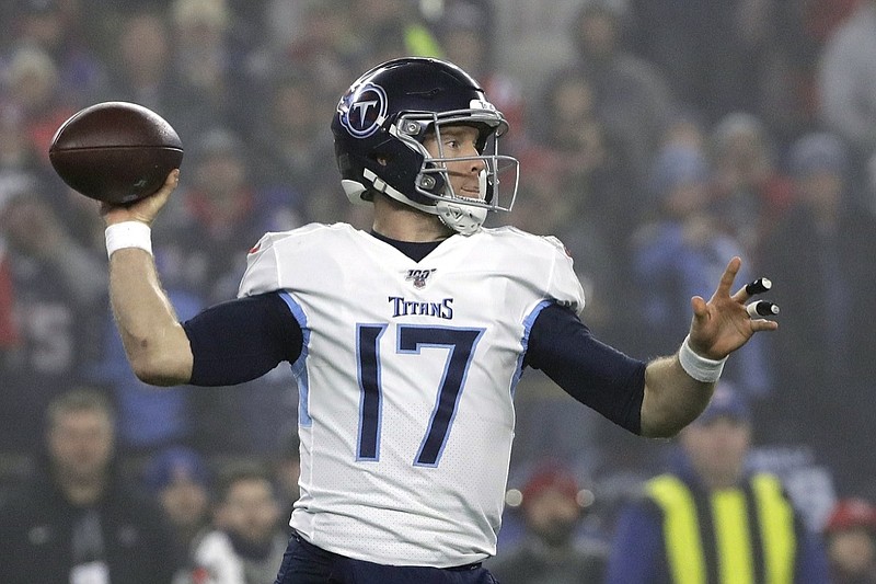 FILE - In this Saturday, Jan. 4, 2020, file photo, Tennessee Titans quarterback Ryan Tannehill passes against the New England Patriots in the first half of an NFL wild-card playoff football game, in Foxborough, Mass. In a deal announced Sunday, March 15, 2020, the Titans agreed to a four-year, $118 million extension with Tannehill. (AP Photo/Elise Amendola, File)