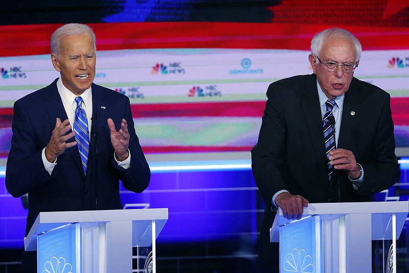 Photo by Wilfredo Lee of The AssociatedPress / In this June 27, 2019, file photo, Democratic presidential candidates, former Vice President Joe Biden and Sen. Bernie Sanders, I-Vermont, speak at the same time during the Democratic primary debate hosted by NBC News at the Adrienne Arsht Center for the Performing Arts in Miami.