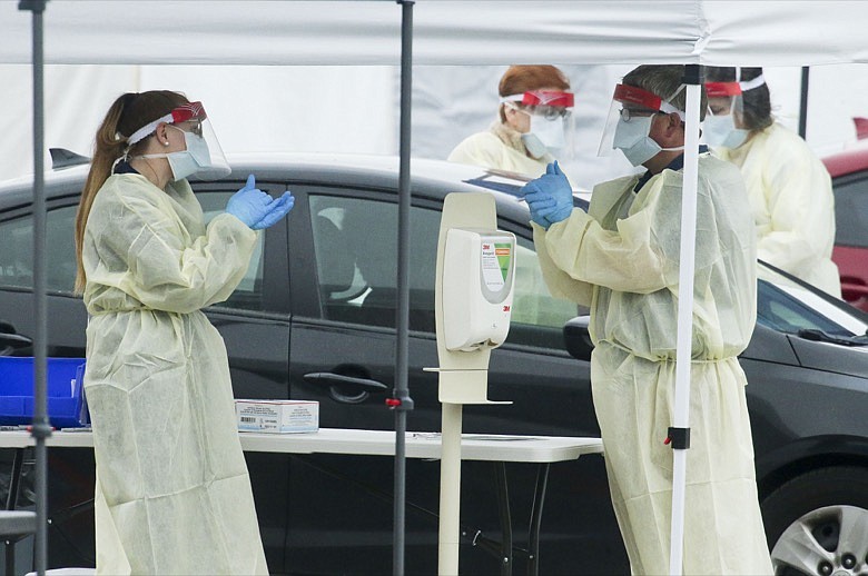 DCH Regional Medical Center opened a drive through testing facility for the COVID-19, the disease that is caused by the new coronavirus, Monday, March 16, 2020, in Tuscaloosa, Alabama. Tuscaloosa had three confirmed cases of COVID-19 as of Monday morning. (Gary Cosby Jr./The Tuscaloosa News via AP)