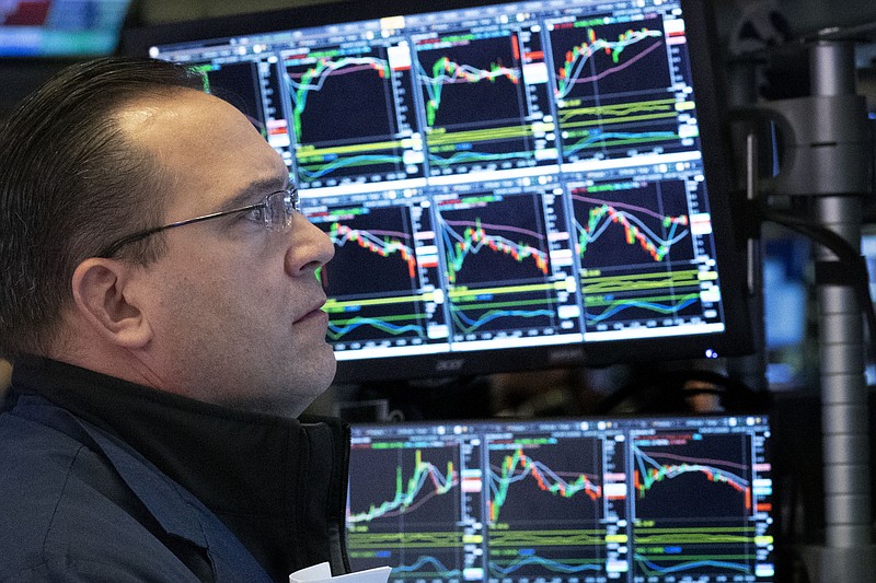 A stock trader works at the New York Stock Exchange, Tuesday, March 17, 2020 in New York. (AP Photo/Mark Lennihan)


