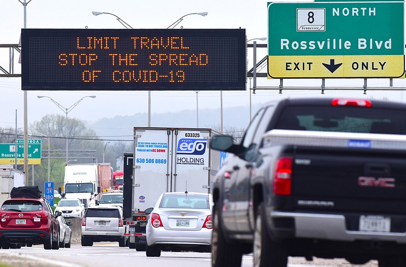 Staff Photo by Robin Rudd / This Tennessee Department of Transportation's Dynamic Message Sign, on Interstate 24 west, just east of the Rossville Blvd. exit in Chattanooga, Tenn., is encouraging people to limit travel during the COVID-19 outbreak.  TDOT signs all along the interstate in Chattanooga had the same message.  The sign was photographed on March 18, 2020. 
